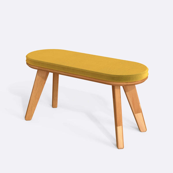 Yase Bench 100 x 38 cm, sarı kadife döşeme, masif kayın gövde, beyaz zeminde üç çeyrek açıdan stüdyo çekimi