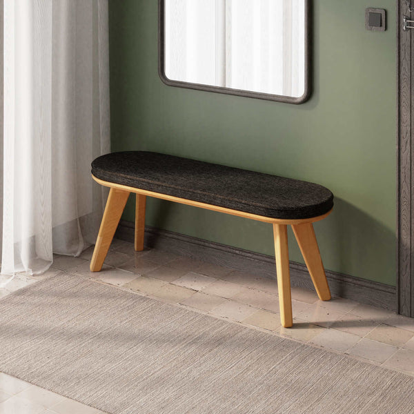 Yase Bench 120 x 38, siyah keten döşemeli oturum ve masif kayın gövde, döşenmiş oda ortamında kullanım görünümü